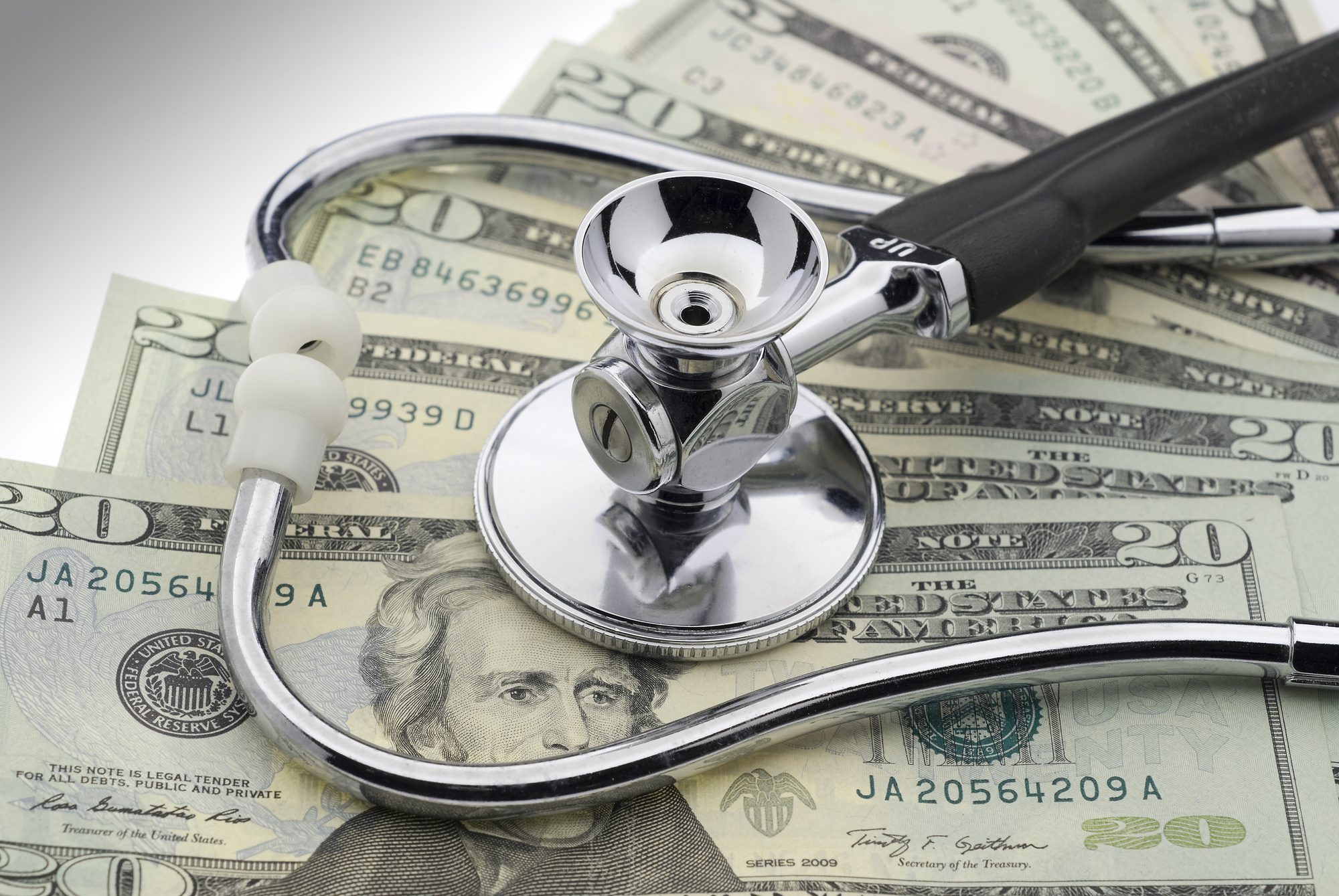  A Portrait Of A Stethoscope With A Dollar Bill Background 